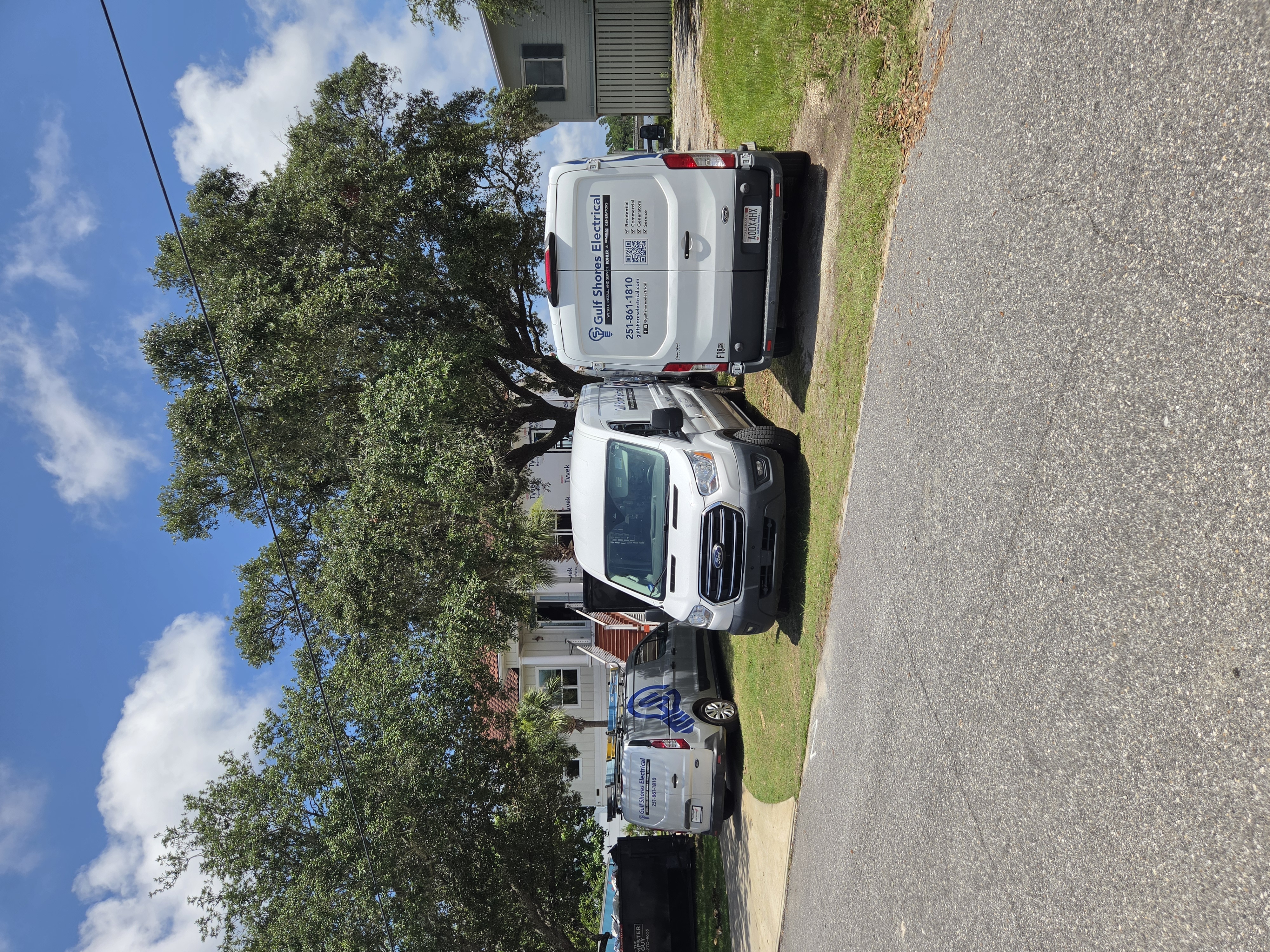 Gulf Shores Electrical service vans on a job site